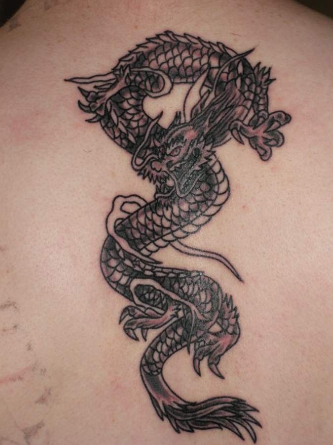Black Ink Dragon Tattoo Design For Girl Upper Back