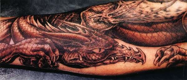 Black Ink Dragon Tattoo On Forearm