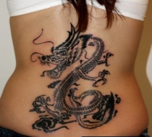 Black Ink Dragon Tattoo On Girl Lower Back