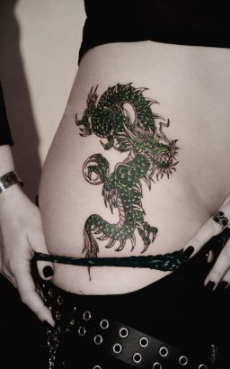 Black Ink Dragon Tattoo On Girl Right Side Hip