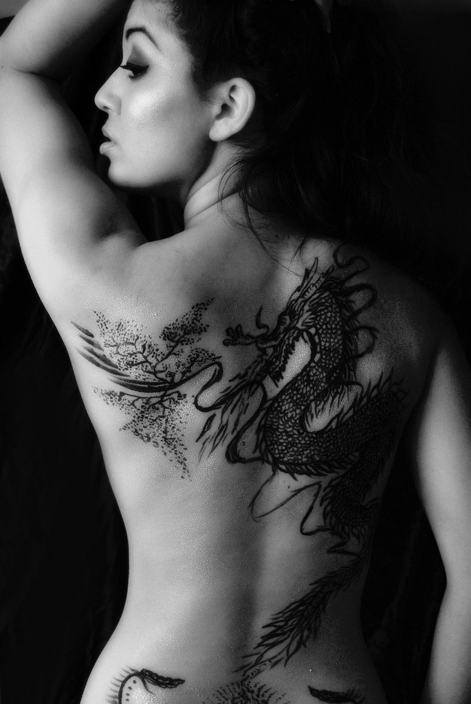 Black Ink Dragon Tattoo On Girl Upper Back