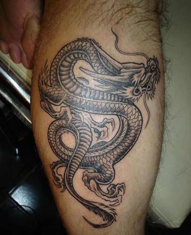 Black Ink Dragon Tattoo On Leg Calf