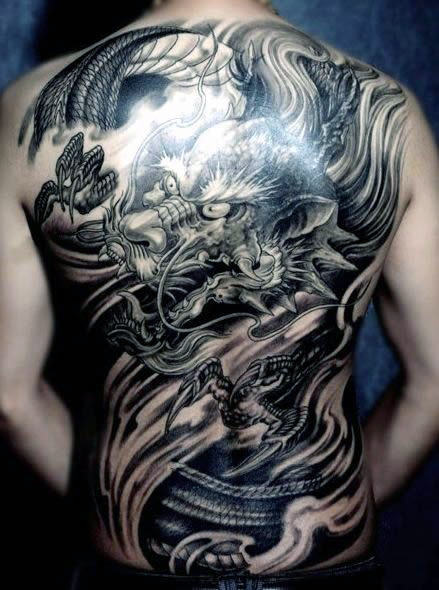 Black Ink Dragon Tattoo On Man Full Back