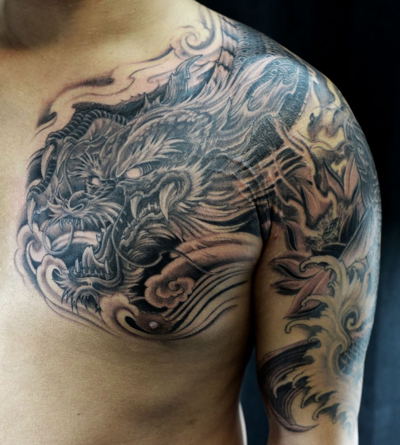 Black Ink Dragon Tattoo On Man Left Half Sleeve And Chest