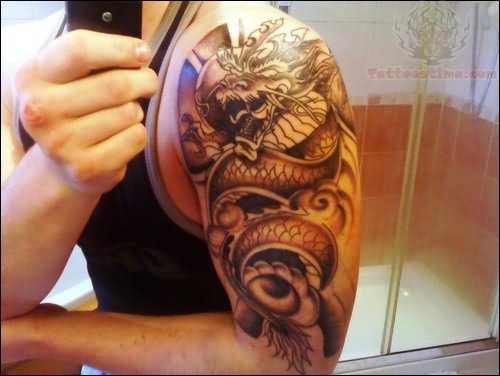 Black Ink Dragon Tattoo On Man Left Half Sleeve