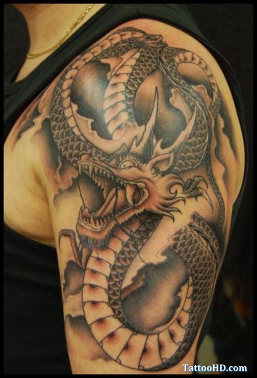 Black Ink Dragon Tattoo On Man Left Shoulder