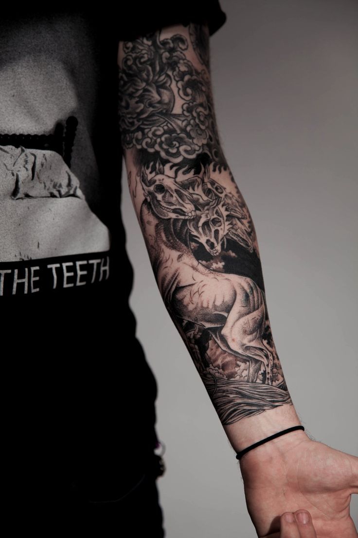 Black Ink Dragon Tattoo On Man Left Sleeve