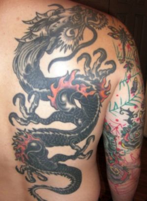 Black Ink Dragon Tattoo On Man Right Back Shoulder