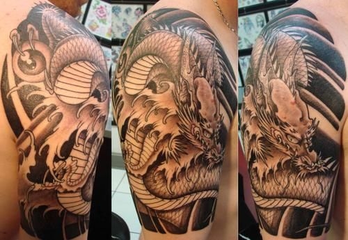 Black Ink Dragon Tattoo On Man Right Half Sleeve