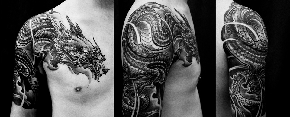 Black Ink Dragon Tattoo On Man Right Shoulder And Half Sleeve