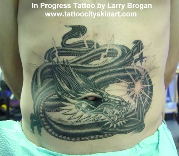 Black Ink Dragon Tattoo On Man Stomach