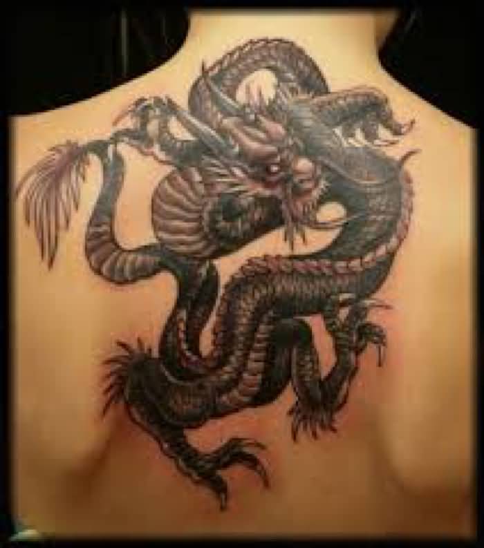 Black Ink Dragon Tattoo On Man Upper Back