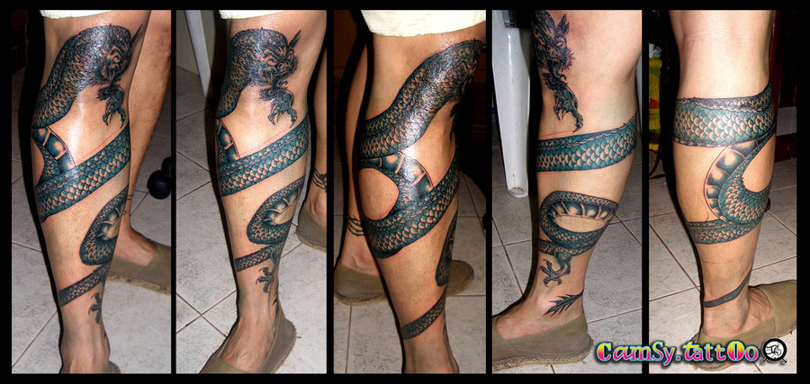 Black Ink Dragon Tattoo On Right Leg