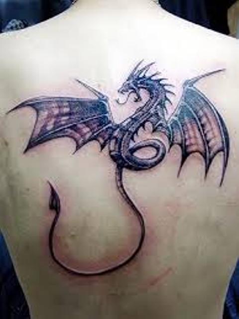 Black Ink Dragon Tattoo On Upper Back