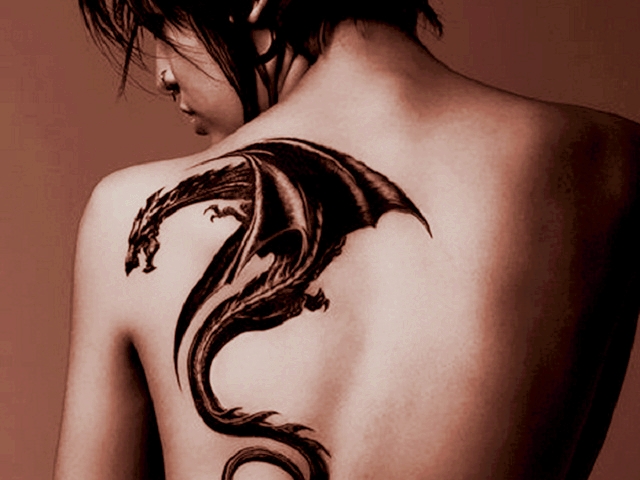 Black Ink Dragon Tattoo On Women Left Back Shoulder