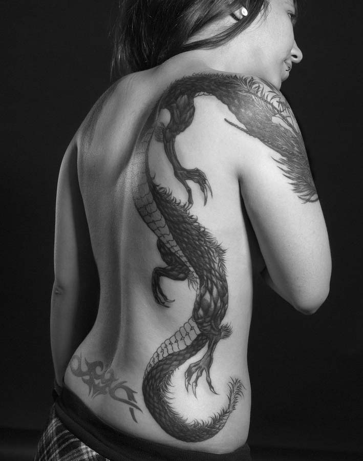 Black Ink Dragon Tattoo On Women Right Side Rib