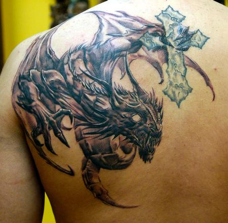 Black Ink Dragon With Cross Tattoo On Left Back Shoulder