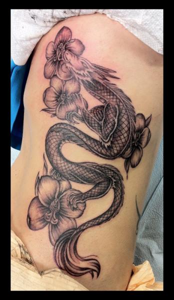 Black Ink Dragon With Flowers Tattoo On Side Rib