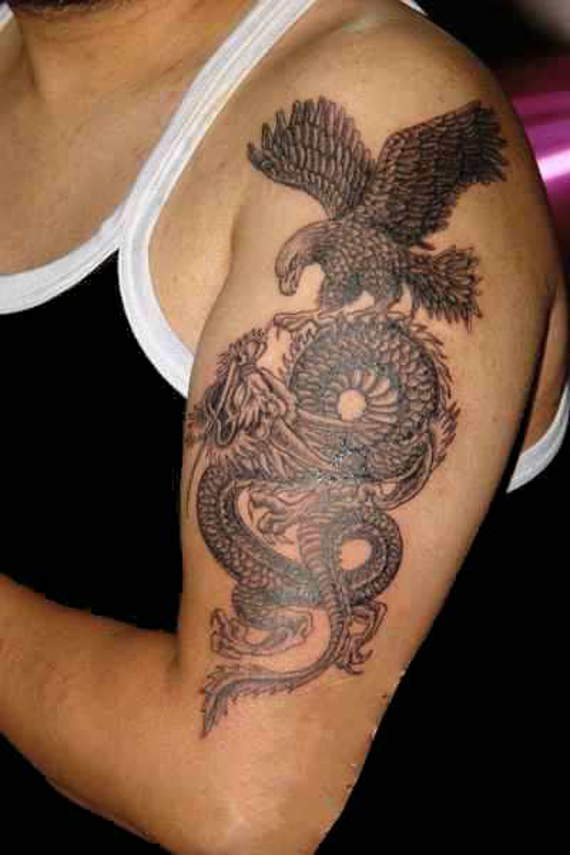 Black Ink Dragon With Flying Eagle Tattoo On Man Left Half Sleeve