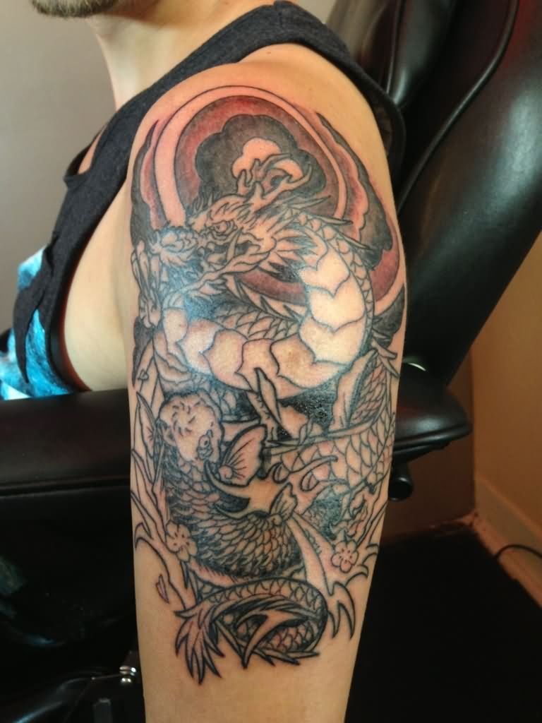 Black Ink Dragon With Koi Fish Tattoo On Man Left Half Sleeve
