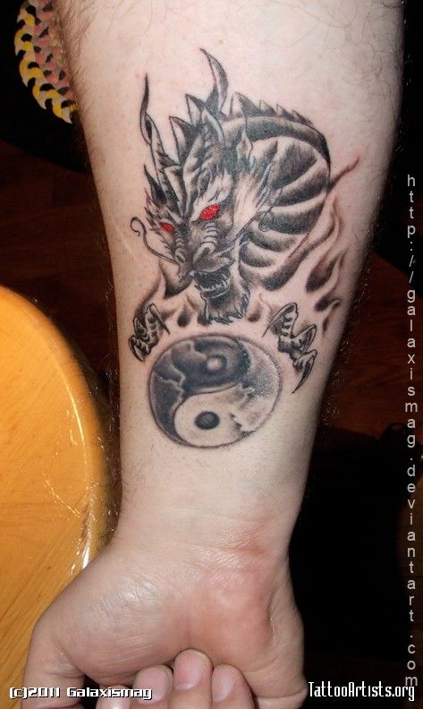 Black Ink Dragon With Yin Yang Tattoo On Right Forearm