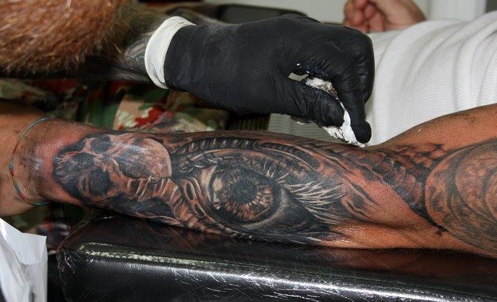 Black Ink Eye Tattoo On Left Arm