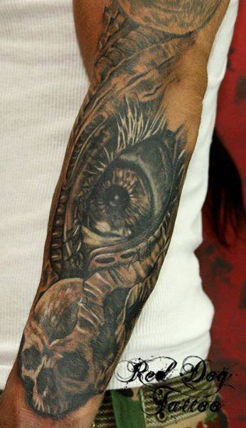 Black Ink Eye With Skull Tattoo On Left Arm
