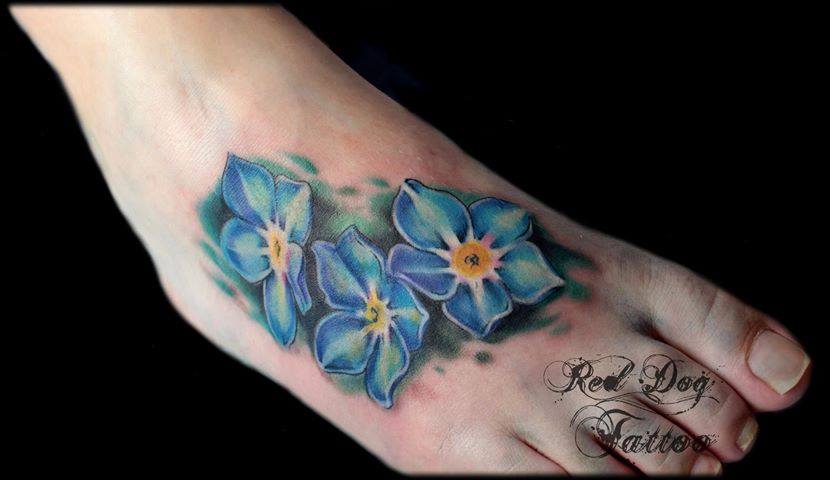 Black Ink Flower Tattoo On Right Foot