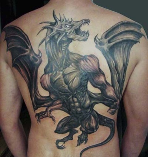 Black Ink Flying Dragon Tattoo On Man Full Back