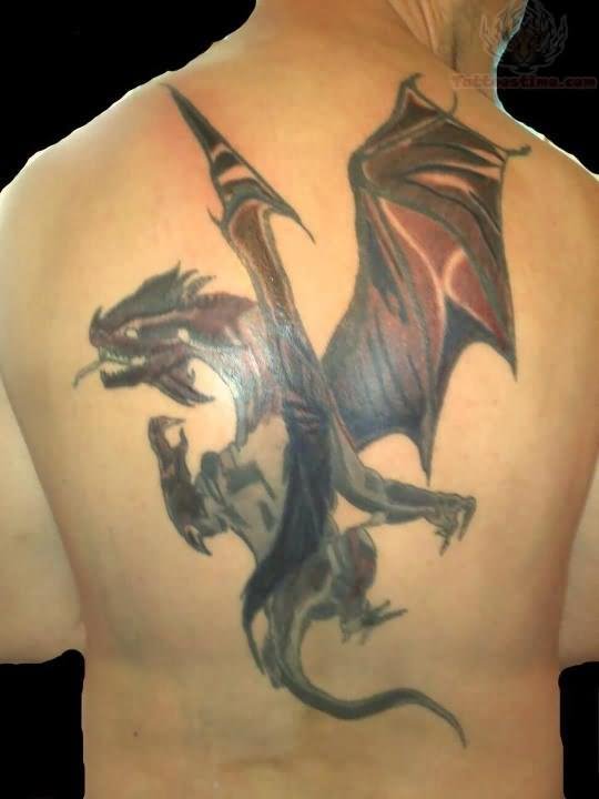 Black Ink Flying Dragon Tattoo On Man Upper Back