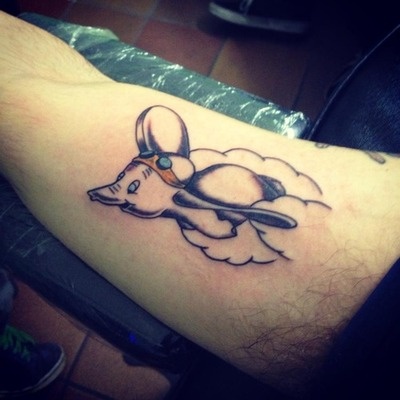 Black Ink Flying Dumbo Tattoo On Left Half Sleeve