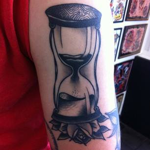 Black Ink Hourglass Tattoo On Right Half Sleeve