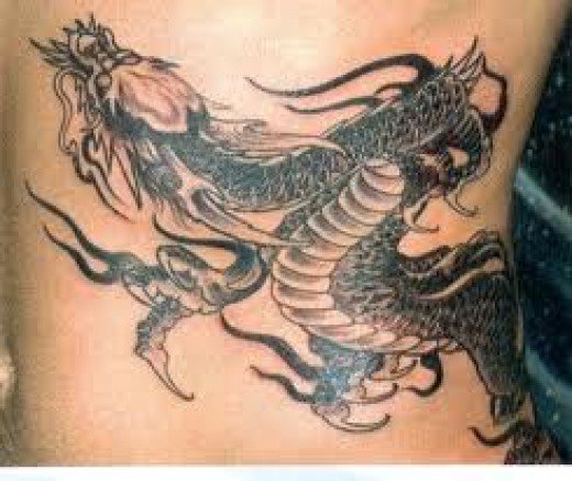 Black Ink Japanese Dragon Tattoo On Man Left Side Rib