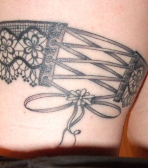 Black Ink Lace Corset Bow Tattoo Design For Sleeve