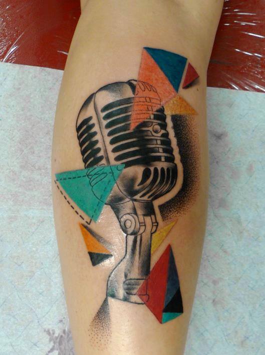 Black Ink Mic Tattoo On Leg Calf