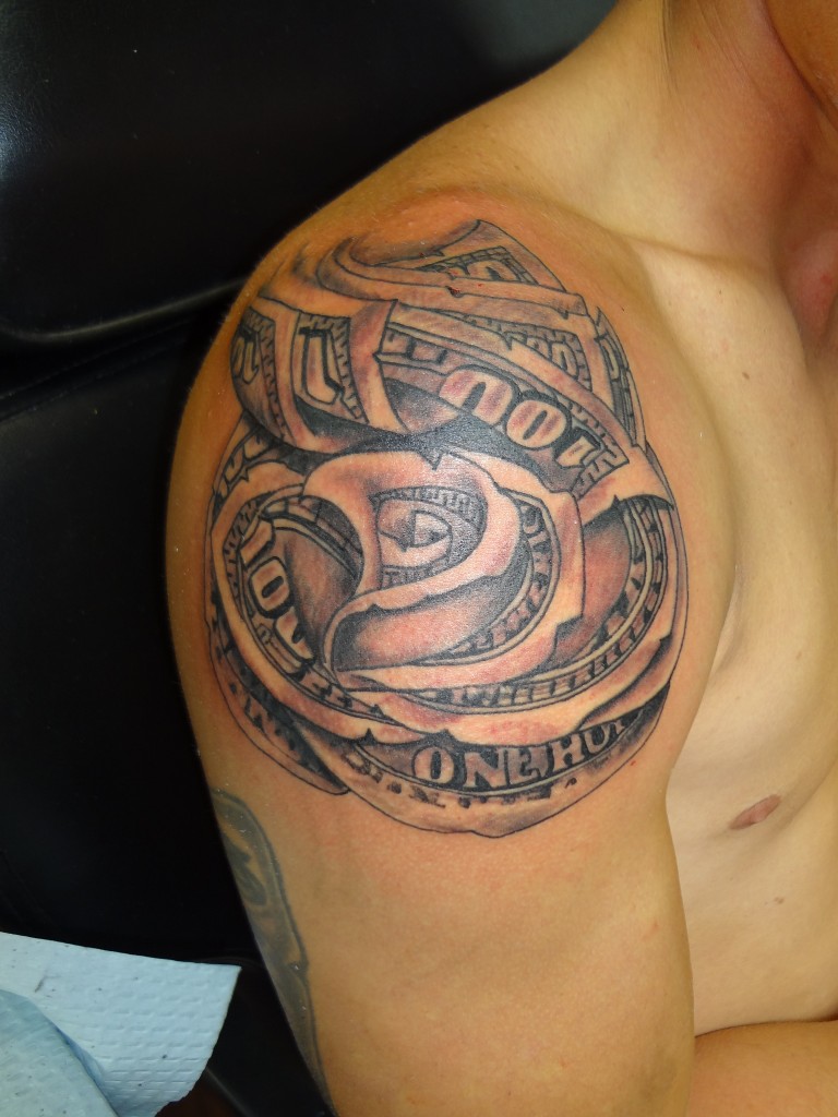 Black Ink Money Rose Tattoo On Man Right Shoulder