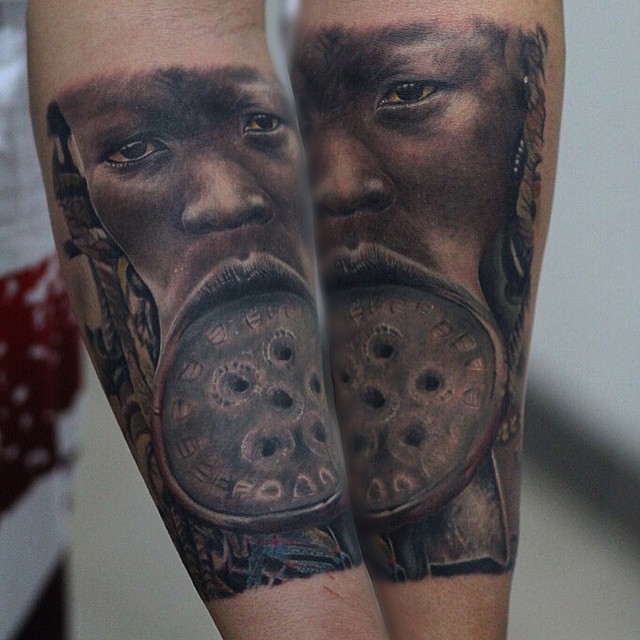 Black Ink Native African Man Face Tattoo On Forearm