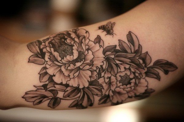 Black Ink Peony Flower Tattoo On Bicep