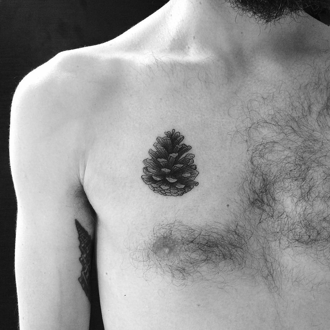 Black Ink Pine Cone Tattoo On Man Right Chest