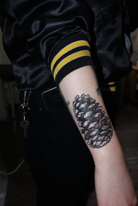 Black Ink Pine Cone Tattoo On Right Arm