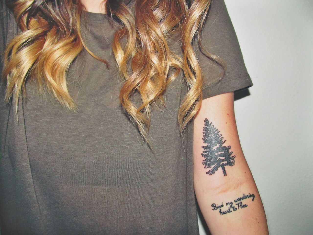 Black Ink Pine Tree Tattoo On Women Left Bicep