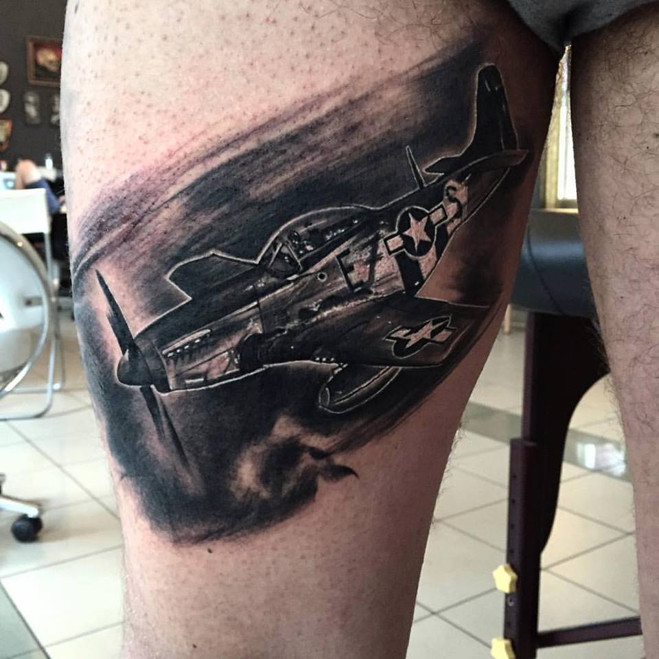 Black Ink Plane Tattoo On Right Thigh