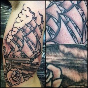 Black Ink Ship With Rose Tattoo Design For Bicep By Chris Martin