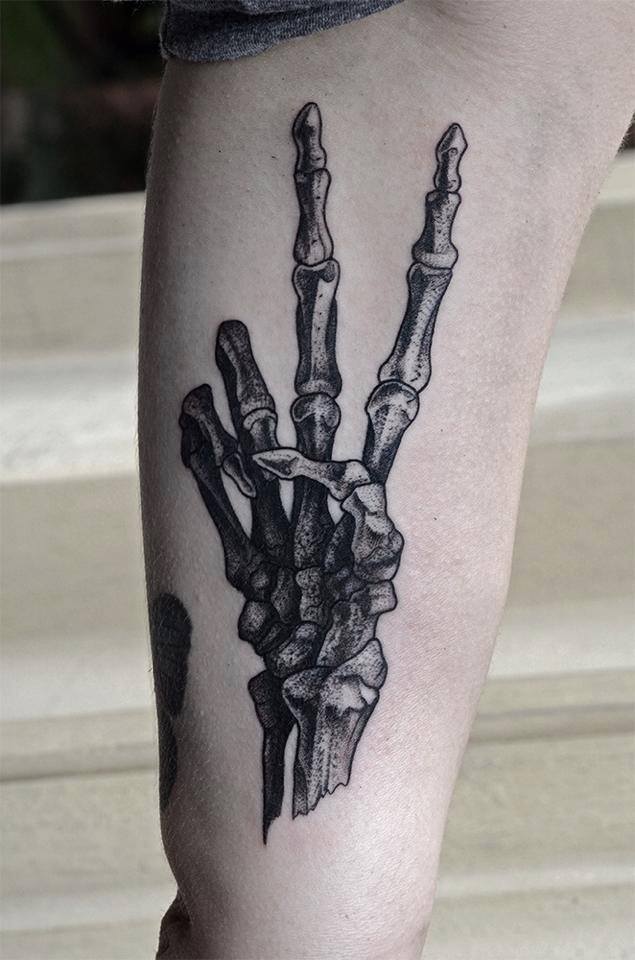 Black Ink Skeleton Hand Tattoo On Left Bicep By Bartosz Wojda