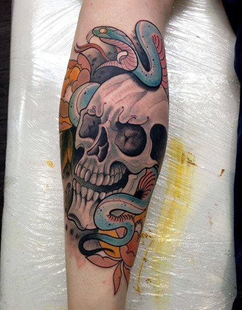 Black Ink Skull With Snake Tattoo On Leg Calf