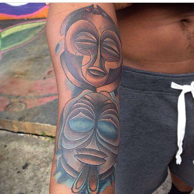 Black Ink Two African Mask Tattoo On Right Forearm