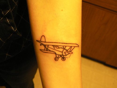 Black Outline Airplane Tattoo On Forearm