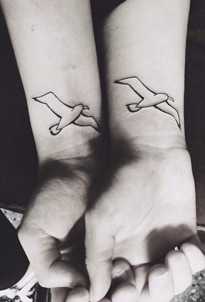 Black Outline Albatross Tattoo On Couple Wrist