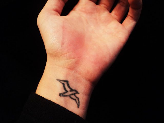 Black Outline Albatross Tattoo On Left Wrist