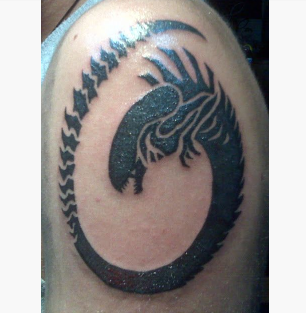 Black Tribal Alien Tattoo On Left Shoulder